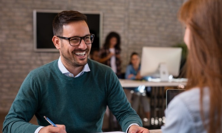 Business person interviewing a woman