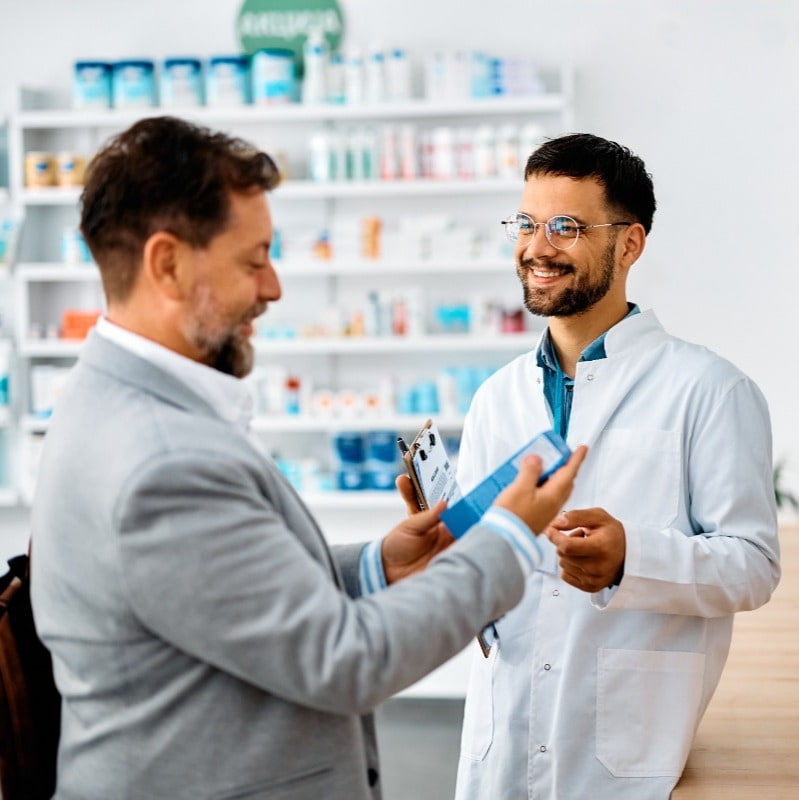 picture of pharmacist discussing with customer