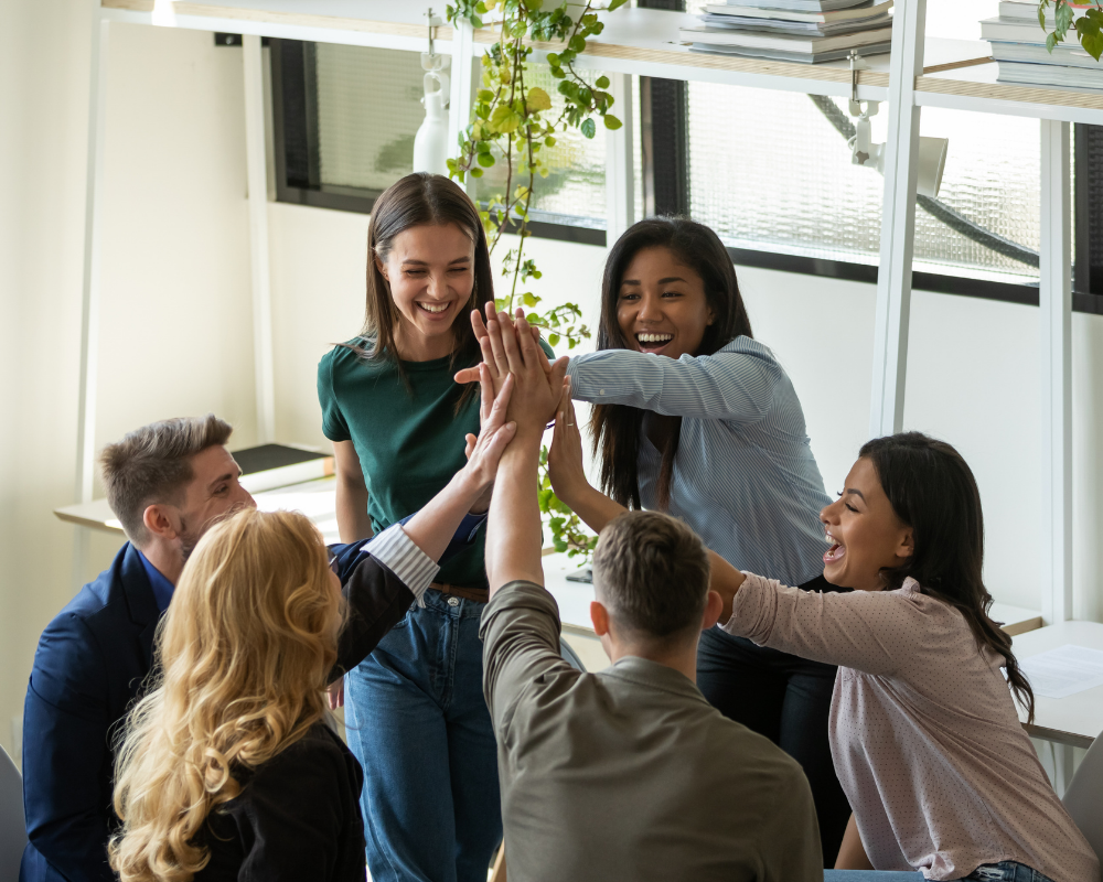 Team of people high fiving