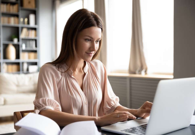 Woman working on a laptop. 