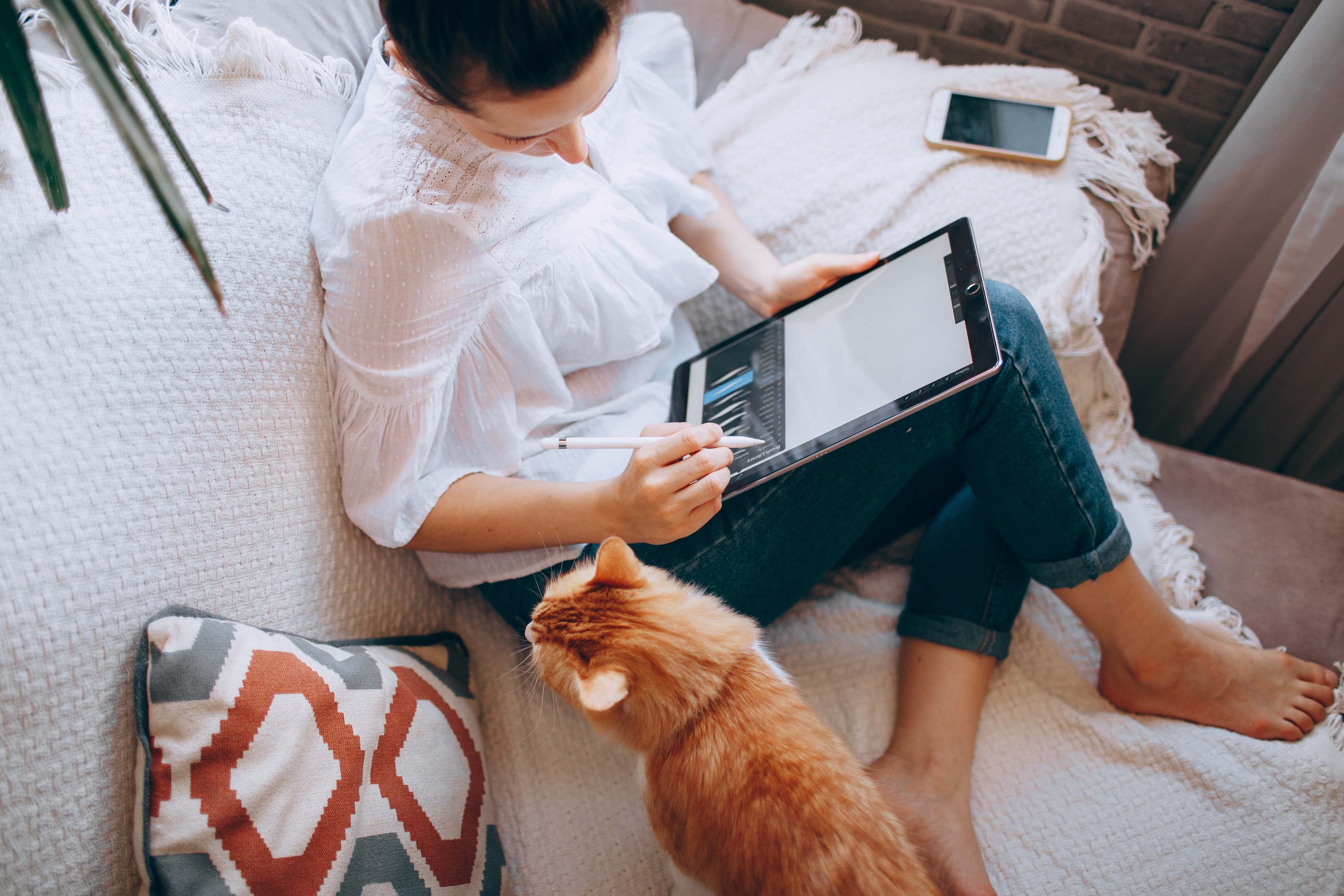 Woman Drawing on Tablet