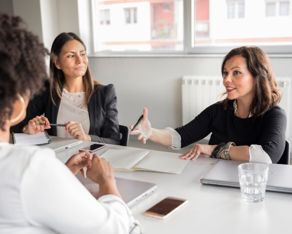 An interview at a desk with three people