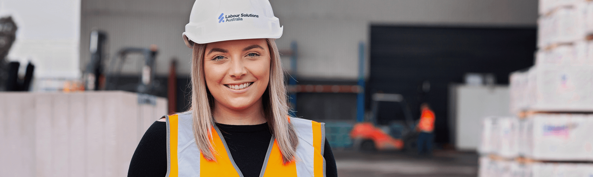 Girl in Labour Solutions Australia hardhat