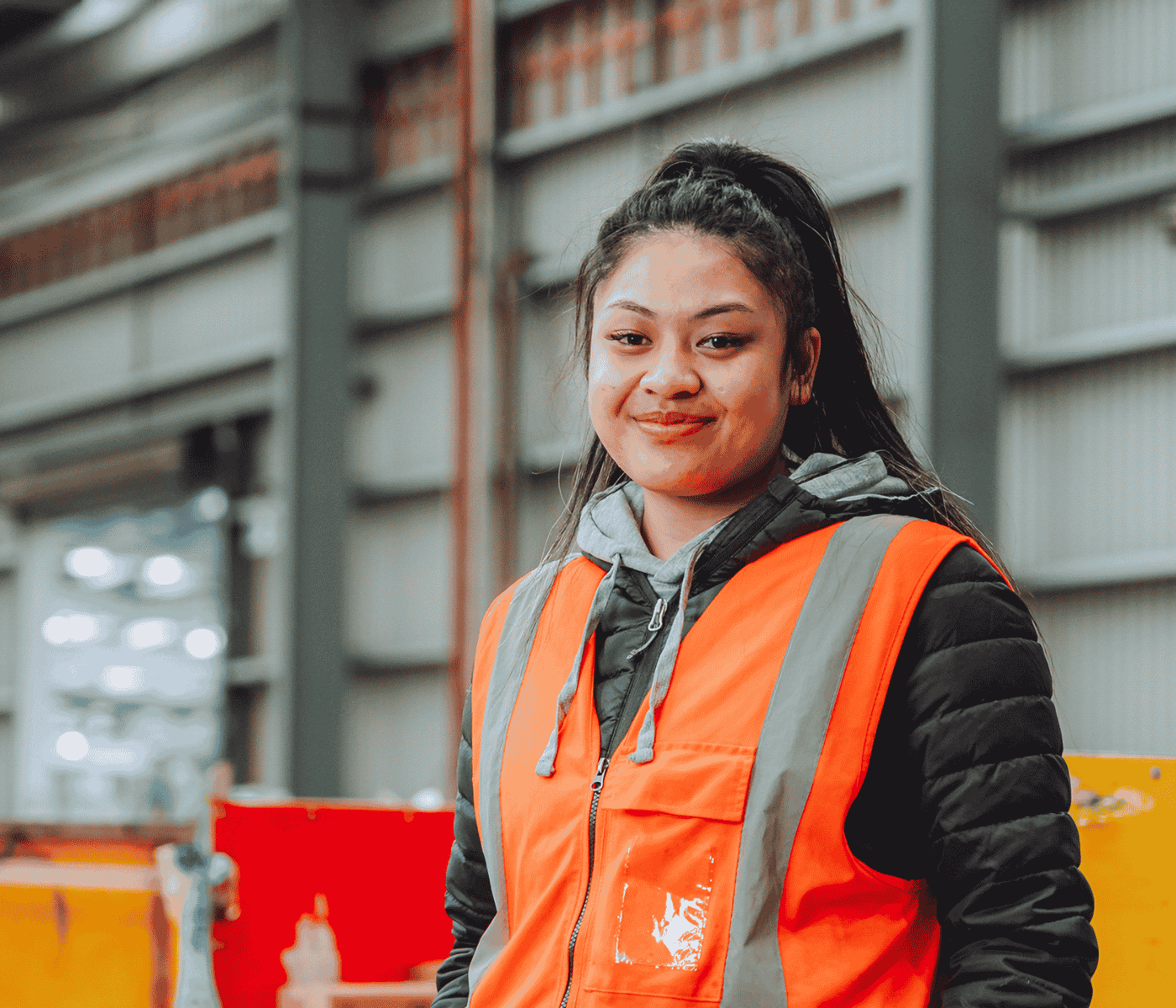 Female Manufacturing employee smiling