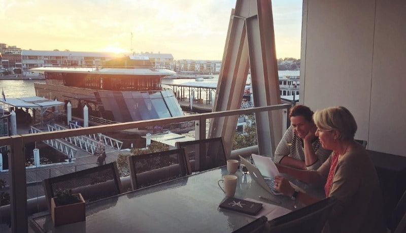 Meeting on balcony during sunset sydney