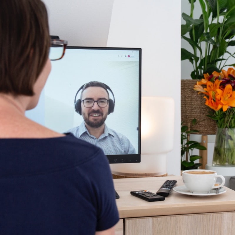 Remote career coaching session via video call, candidate receiving MedTech job search advice.