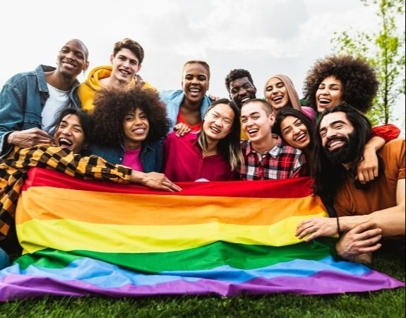 LGBTQIA+ identifying community posing for a picture