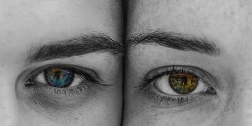 Two people with multicoloured eyes