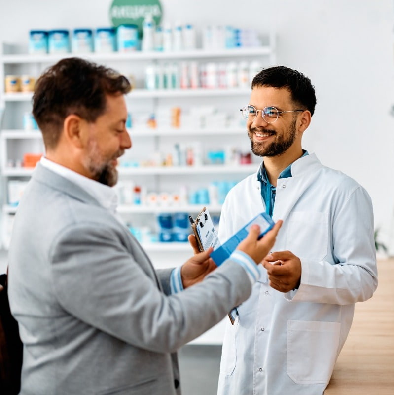 pharmacist having conversation with customer