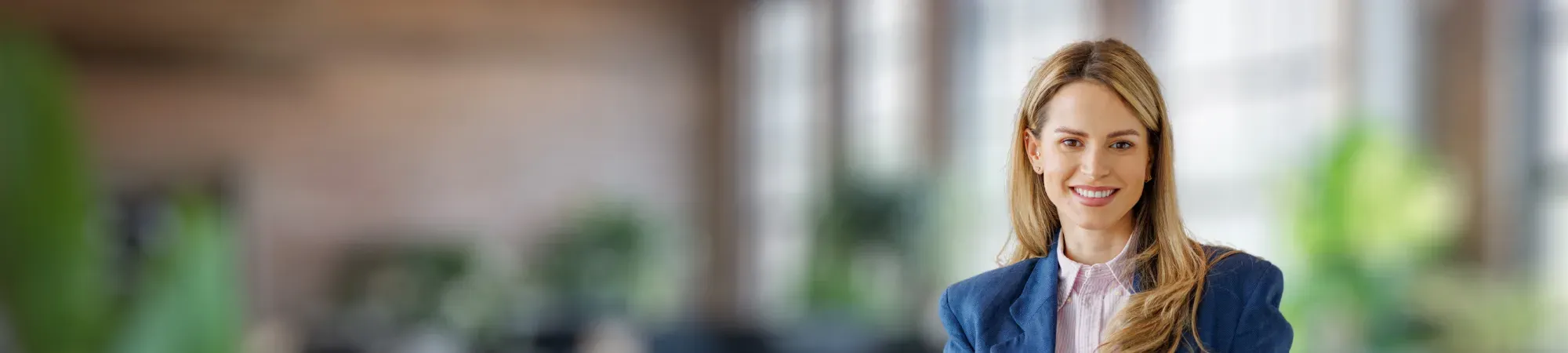 Smiling female employee wearing a blazer