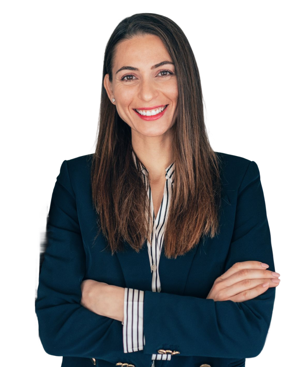 Smiling female professional with arms folded.