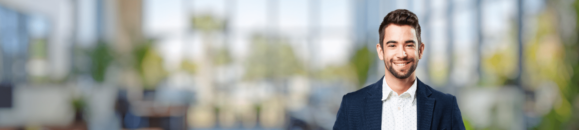 Male professional wearing dark jacket.