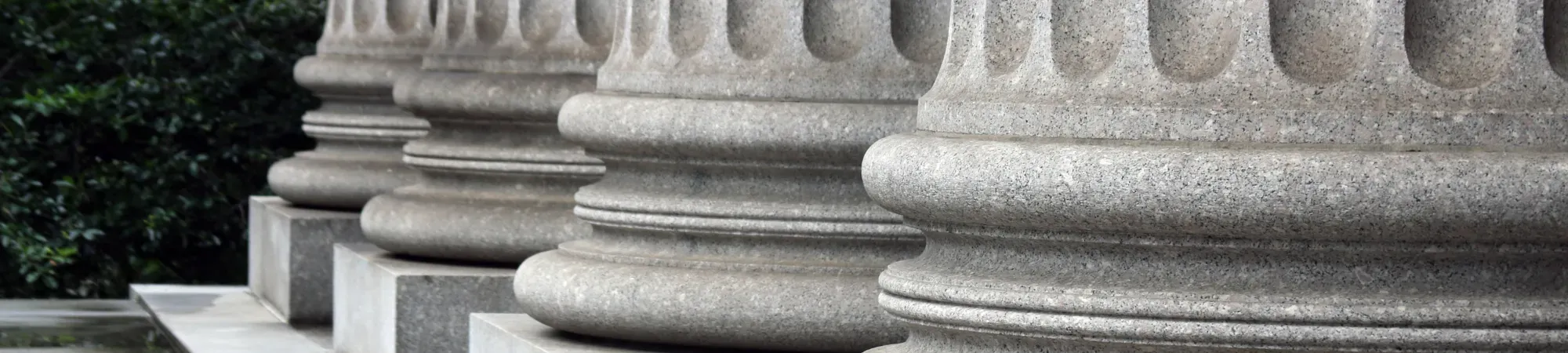 grey stone columns in a row