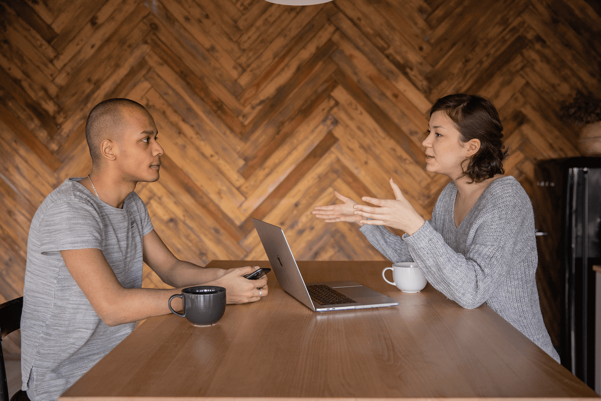 Photograph of Meeting Between Two Workers