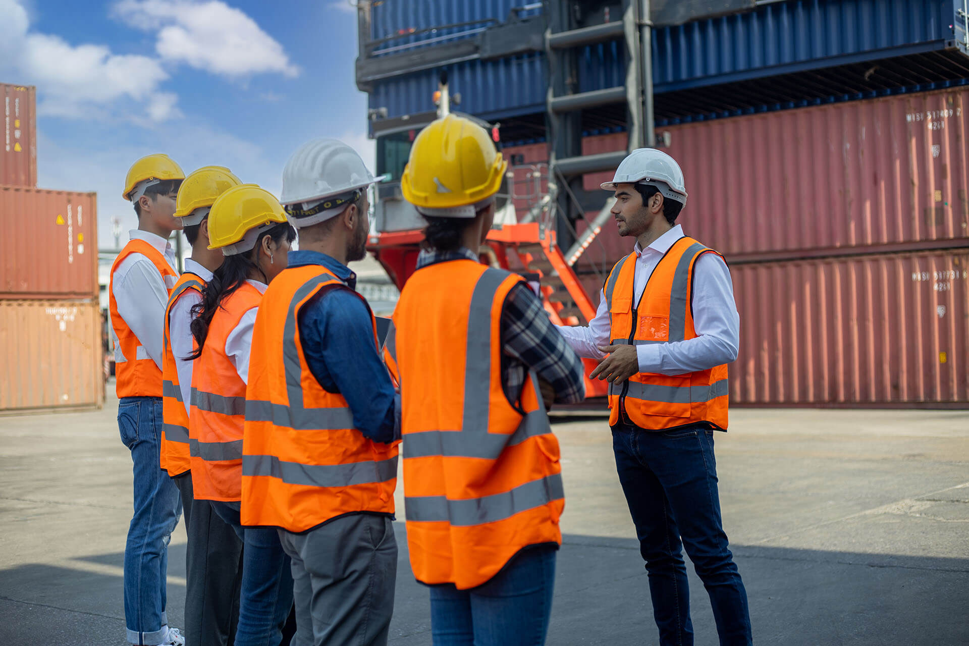 Photograph of manager hosting safety meeting onsite with crew