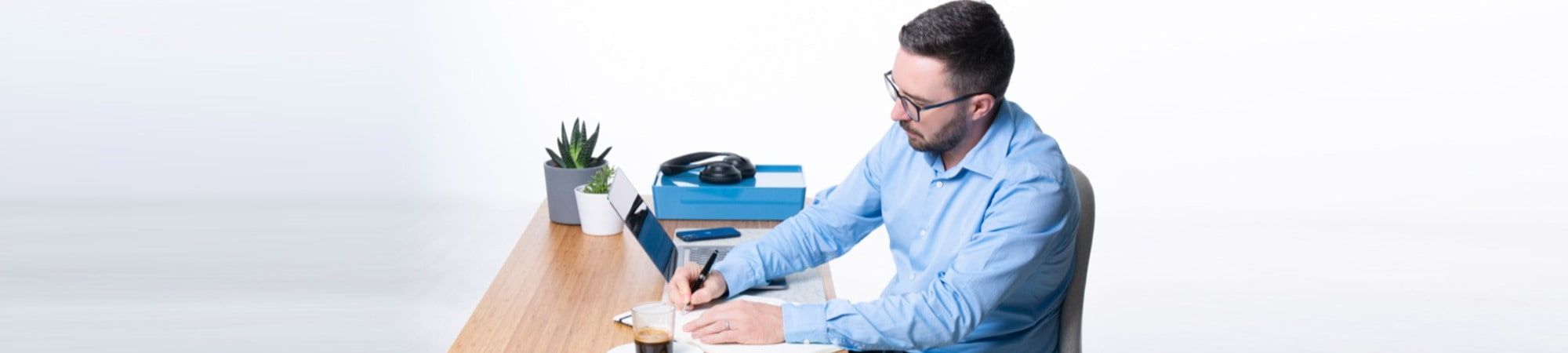 Recruiter writing a blog at a desk with a computer