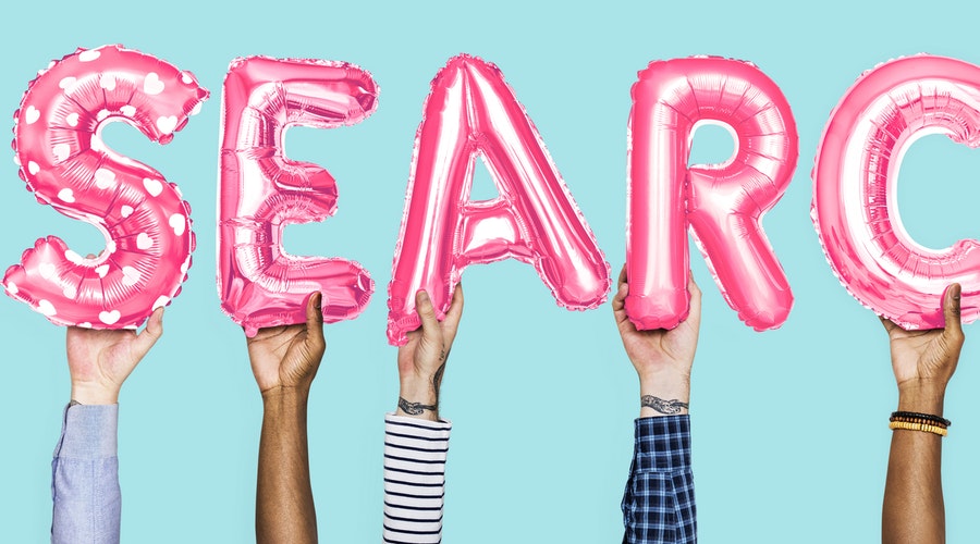 Pink Hellium Balloons showing the word 'Search" for Job Searching