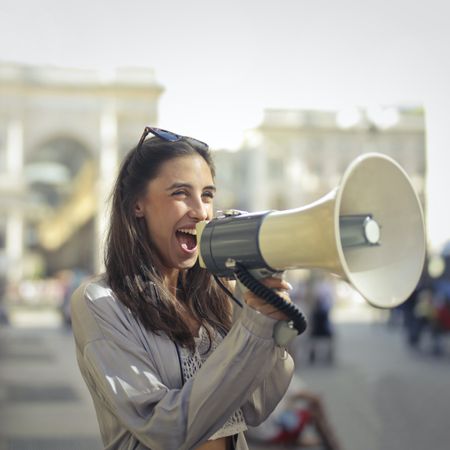 Woman shouting out on loudspeaker