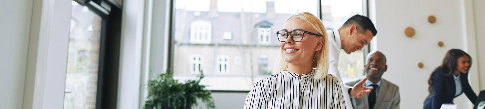 blonde woman smiling in modern office 