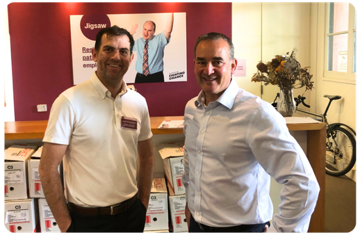two men smiling at the jigsaw location