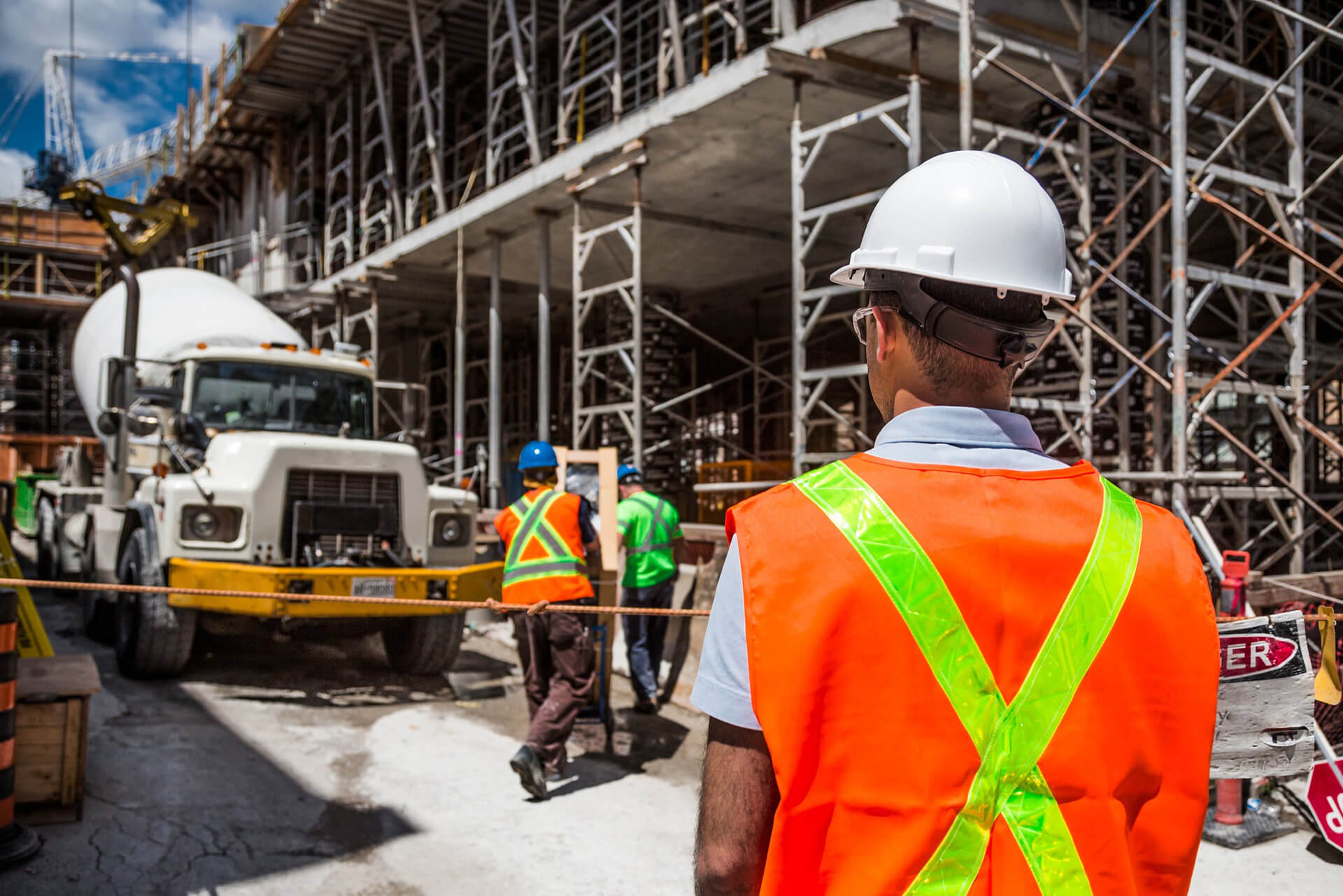 Construction worker examining safety of worksite