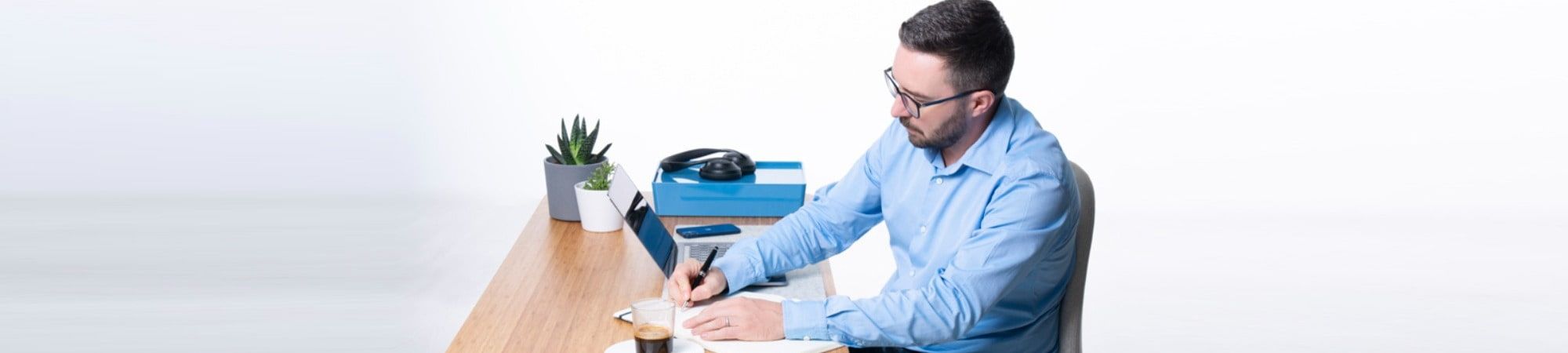 Recruiter writing notes at a desk