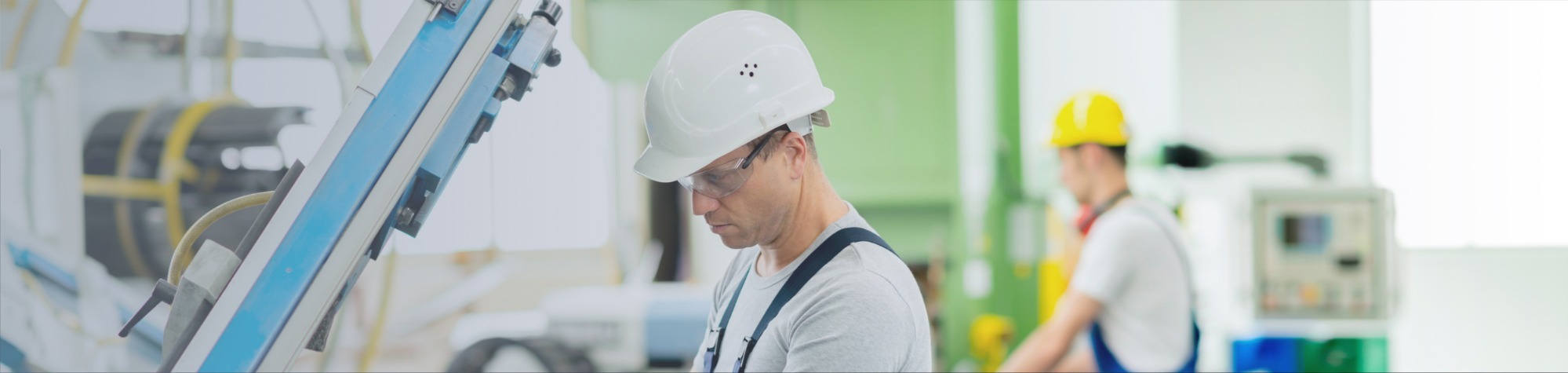 Two workers in a factory