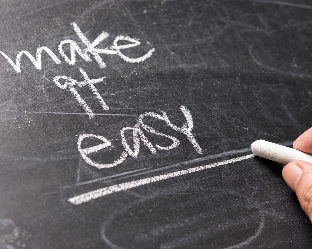 Make it easy written in white chalk on a blackboard