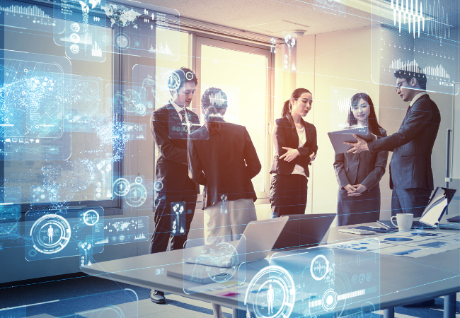 Technology team at a meeting standing and talking. 