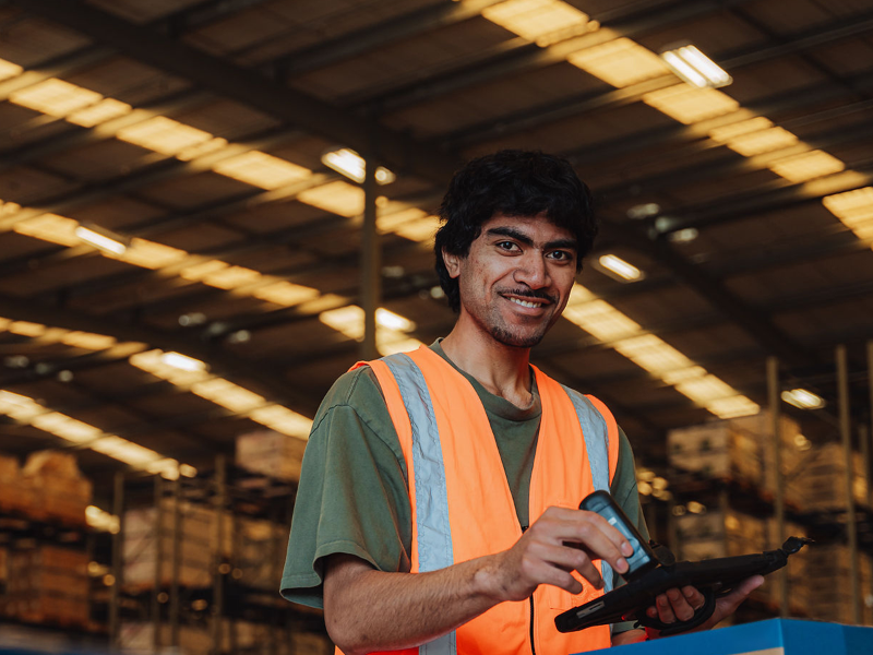 Male Manufacturing employee smiling