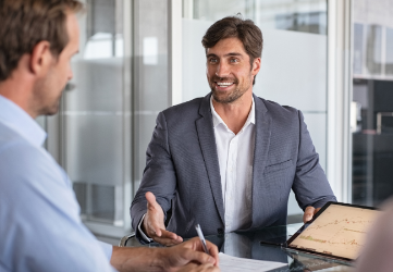 Two business men talking in a meeting. 