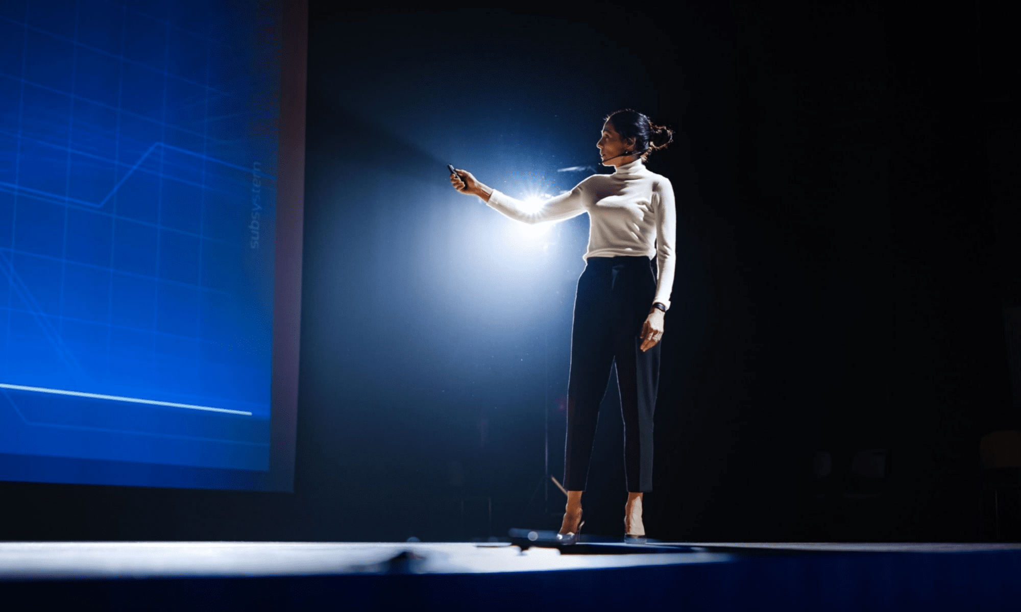 Professional women giving a keynote presentation on stage