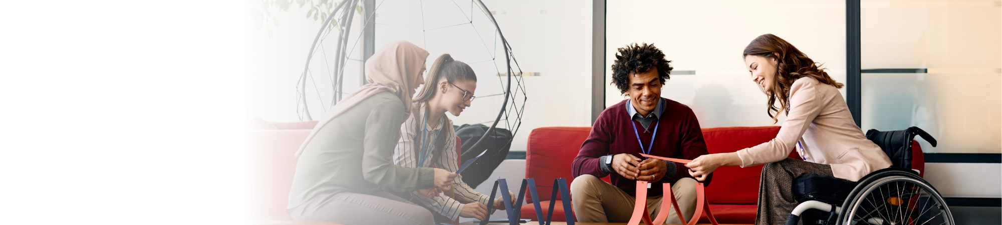 Diverse Colleagues sit around a table professional workplace