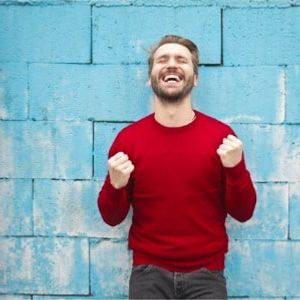 happy young man in red jumper