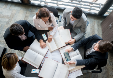 Overhead shot of a team of workers at a table. 