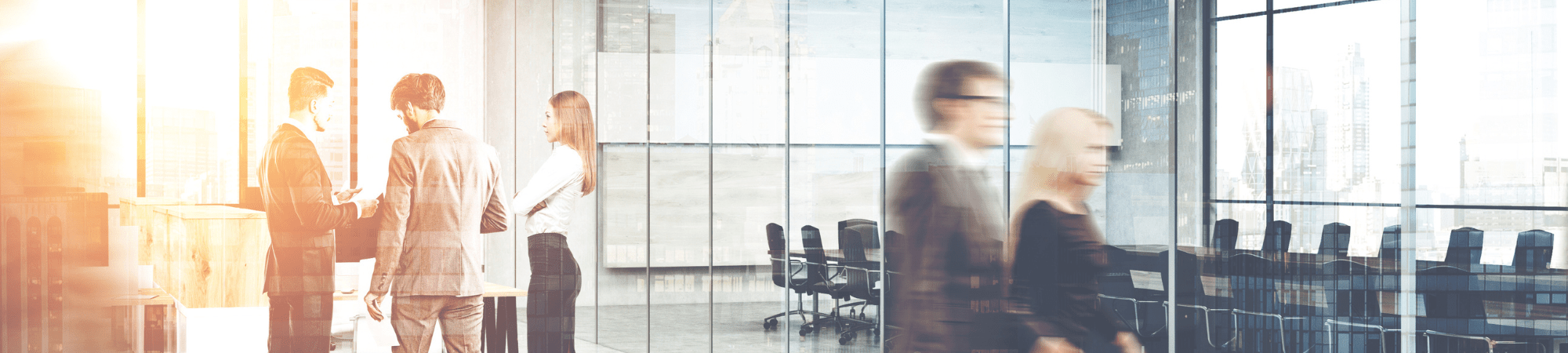 People moving around in an office avoiding job scams