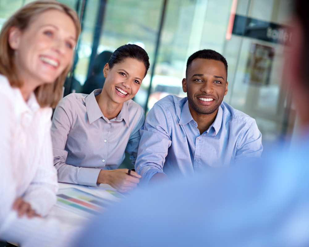 a group of people listening to a sales person