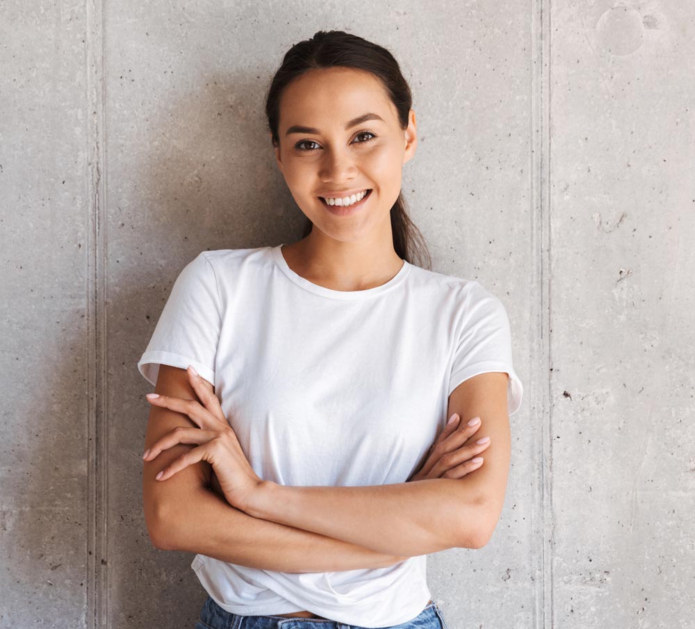 Burnette Long Tied Up Hair Girl Smiling Crossing Arms