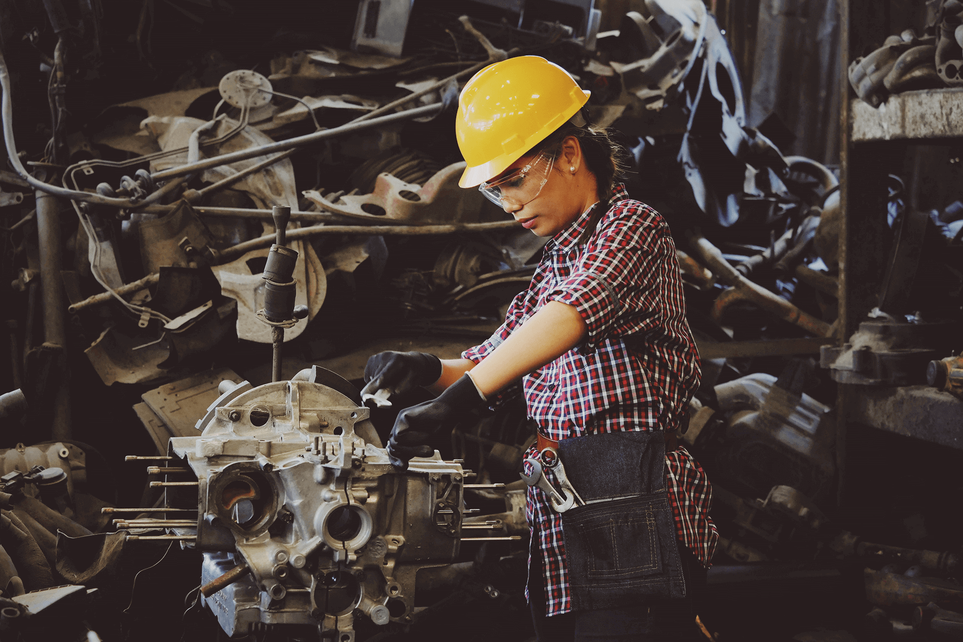 Woman in an Industrial Setting Wearing Full Personal Protective Equipment