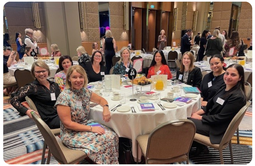 business chicks breakfast group of people sitting around a table