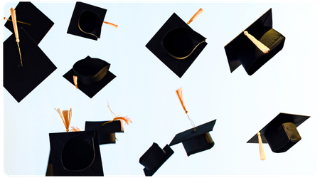 graduation hats in the air