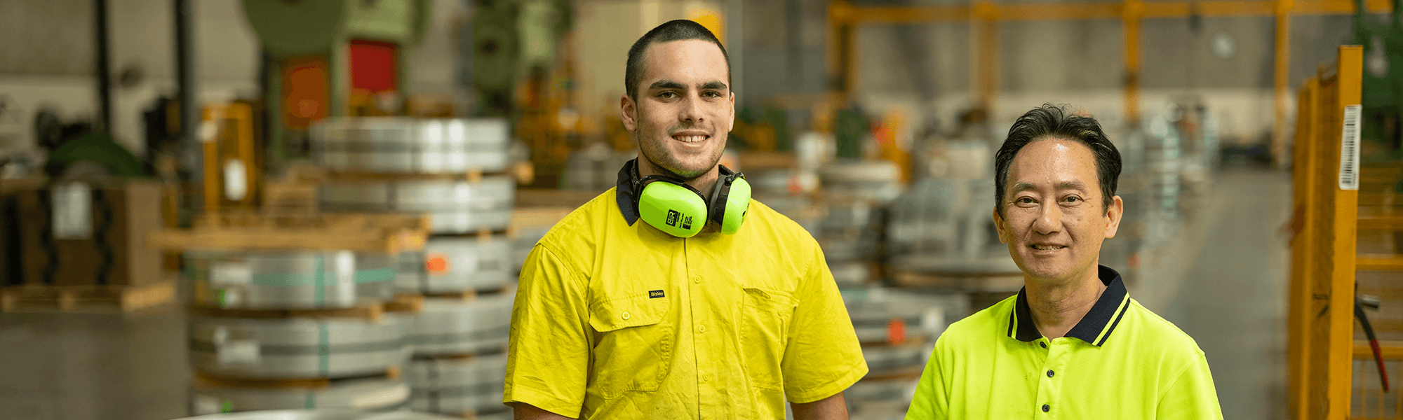 blue collar workers working within a manufacturing facility