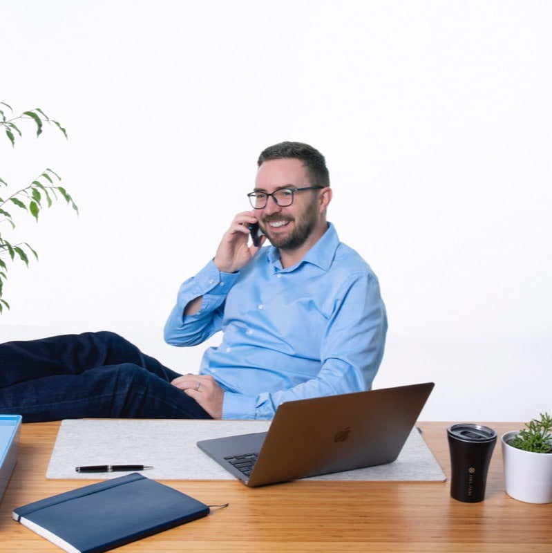 MedTech recruiter providing career guidance over the phone, discussing job opportunities and next steps.