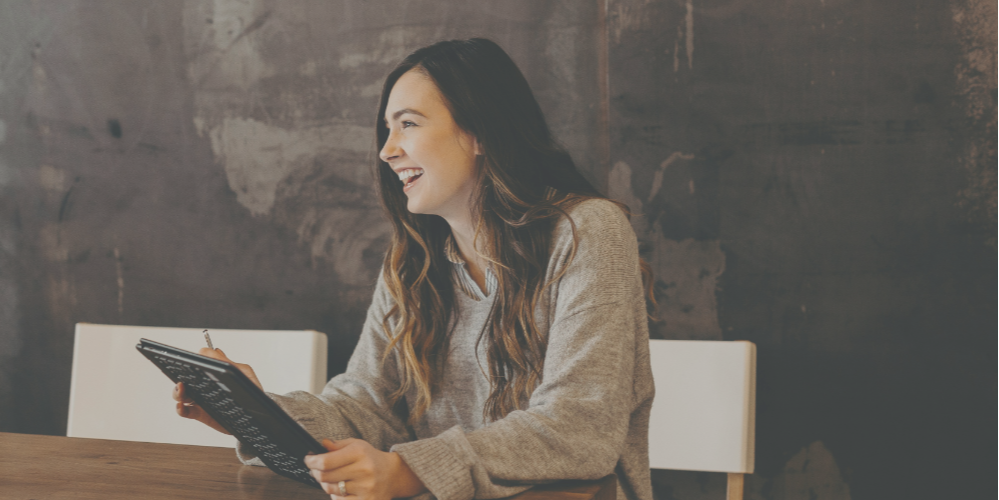 Header image: Woman worker smiling