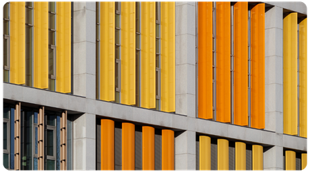 building with yellow and orange window shutters