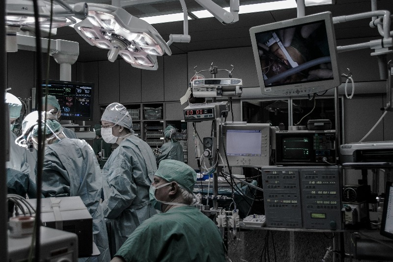 operating theatre with surgeons packed with medical technology
