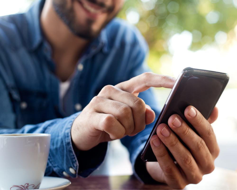 A man applying to a job on his mobile