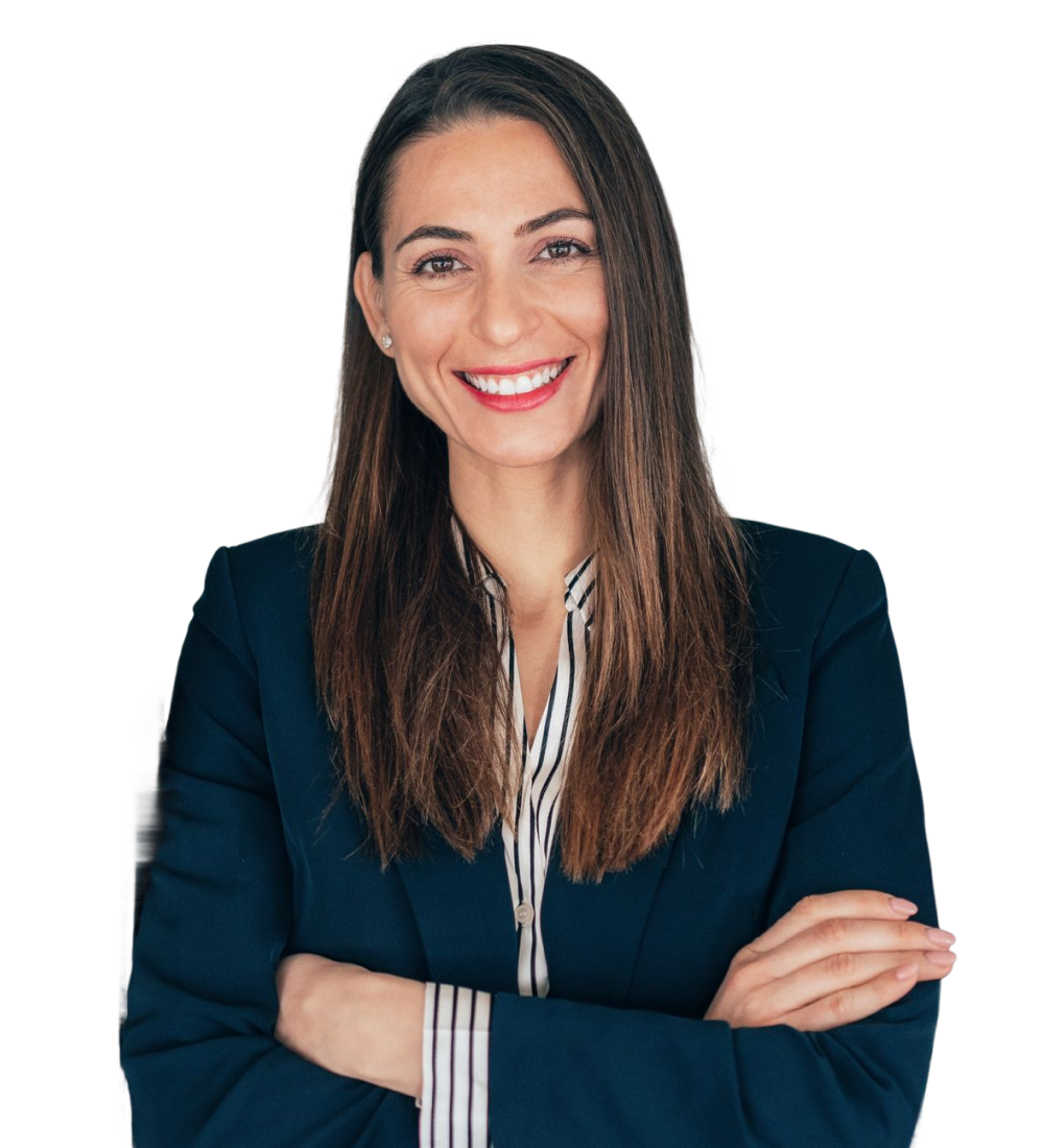 Smiling female professional with arms folded.