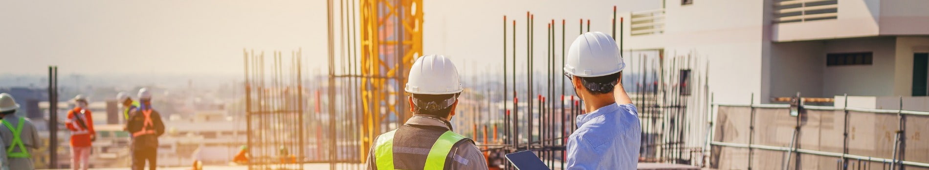 Two contract workers at a building construction site