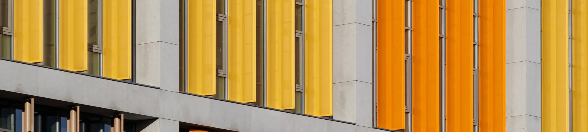 building facade with yellow and orange windows
